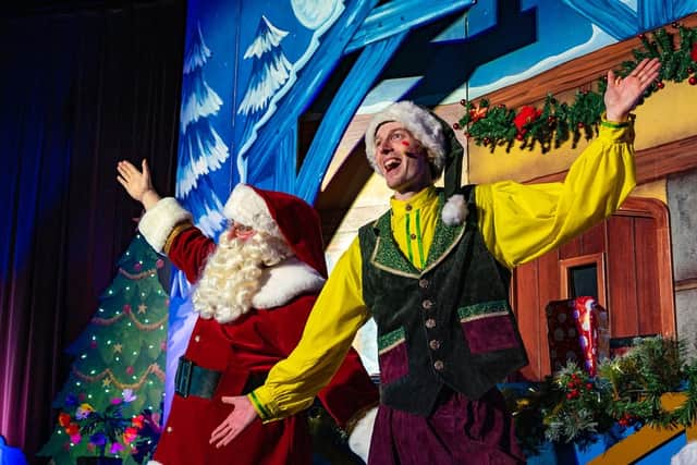 Santa joins Jingles the elf for the show A Christmas Wish.