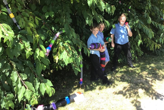 Year 3 used old pipes to create an urban jungle of snakes in threes.