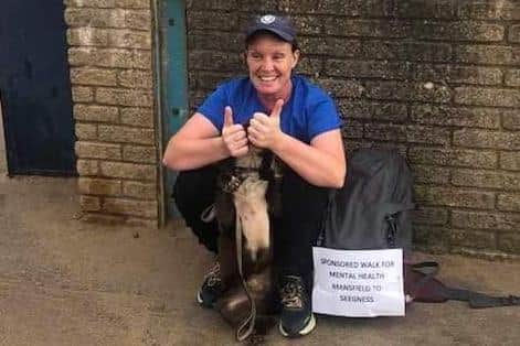 Thumbs up from Kerry Witham and pet dog Newkie as they arrive in Skegness after their epic sponsored walk.