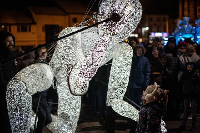 Dundu, the giant, illuminated puppet, meets a wondrous little girl. Expect similar scenes at this weekend's exciting, new event, Light Night Ashfield. (PHOTO BY: Ian Knight)