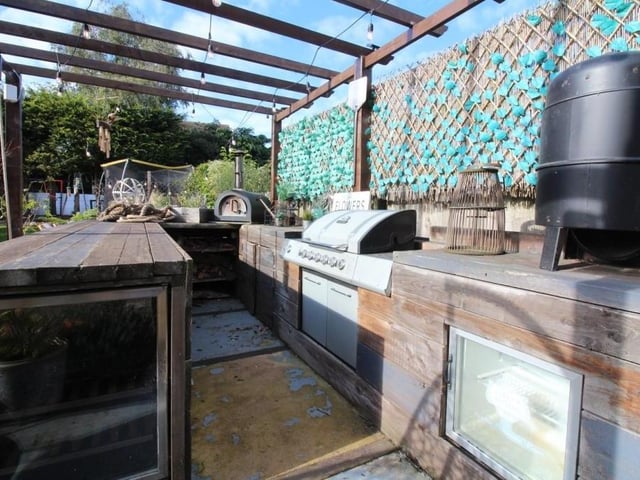 In the garden that keeps on giving, here is a timber-built bar, with electricity and storage space.