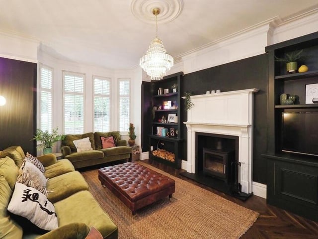 We begin our tour of the £650,000 Mansfield house in this magnificent lounge, which overflows with character features. They include a large bay window and shutters, picture rail, coving, custom-made, built-in shelving and storage cupboards, and also a wood-burning stove.