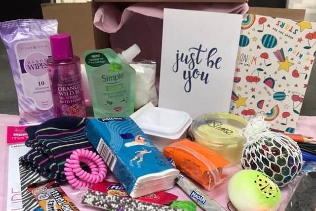 The boxes contain an array of goodies to make under 18's smile - from Haribo to deodorant.