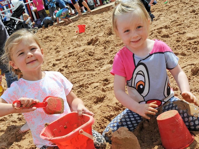 Myla Strang, three, and Evie Cresswell, five, from Blidworth get busy with sand castle building on Mansfield's beach.