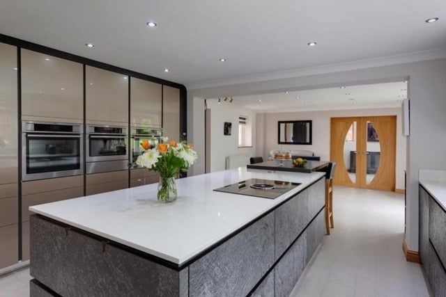 The breakfast kitchen really is an exceptional space, the jewel in the contemporary crown of the house. All appliances are by AEG and include two combination ovens, a microwave, warming drawer, under-counter fridge and integrated dishwasher