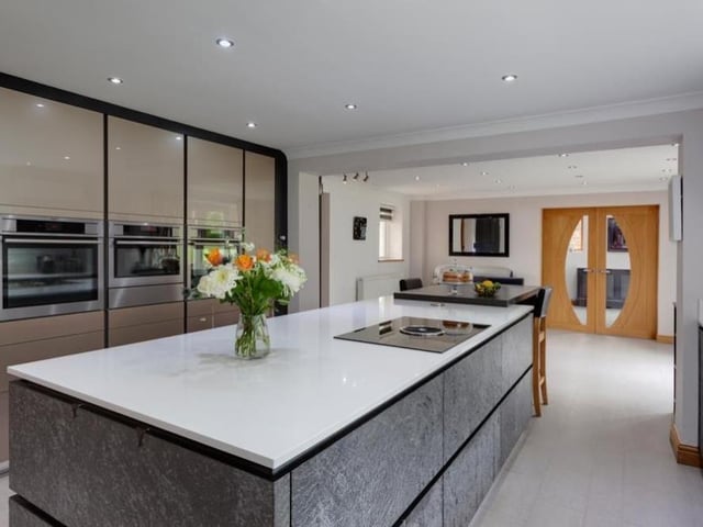 The breakfast kitchen really is an exceptional space, the jewel in the contemporary crown of the house. All appliances are by AEG and include two combination ovens, a microwave, warming drawer, under-counter fridge and integrated dishwasher