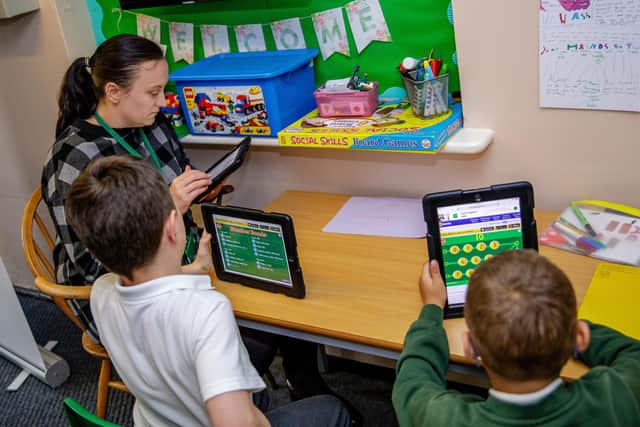 Staff and pupils at Blidworth Oaks Primary School working with the tablets.