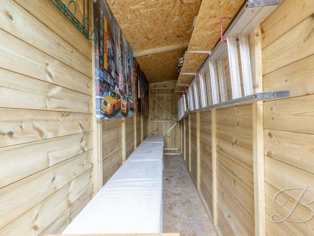 A look inside the converted 'shed' shows how it has been transformed into an additional living space, with new flooring, seating, shelving and electrics. It is thoroughly watertight.