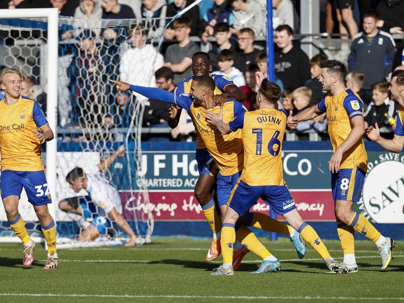 Jordan Bowery is congratulated by Hiram Boateng and Stephen Quinn.