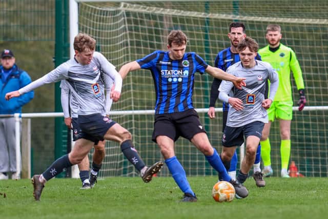 Sherwood Colliery Man of the match Ewan Robson in action.