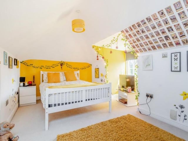 The fifth bedroom on the first floor is full of character.