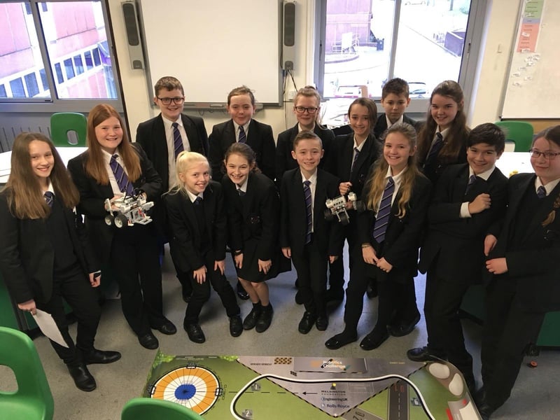 Students from Sutton Community Academy with their robotics project in 2018.