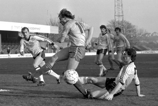 Dave Caldwell is tackled during the visit of Hereford United
