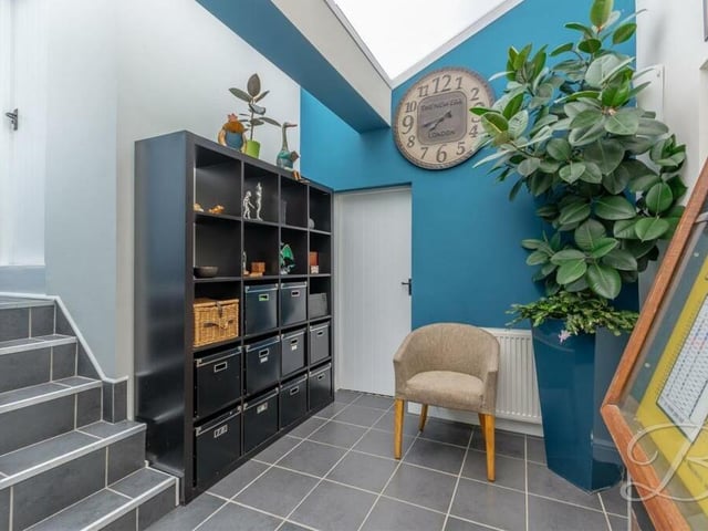 Here is the conservatory within the Church Hill property. Conveniently, it has steps to an internal door that leads to the detached double garage.