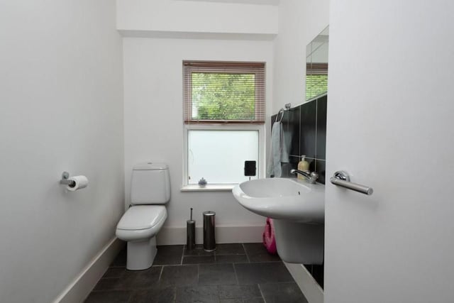 A downstairs toilet is always handy. This one is kitted out stylishly and features a WC and hand wash basin.
