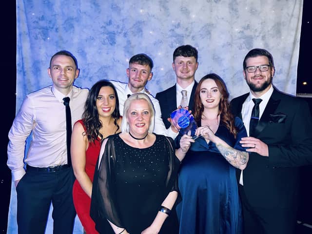 The Your Space team celebrate their award.