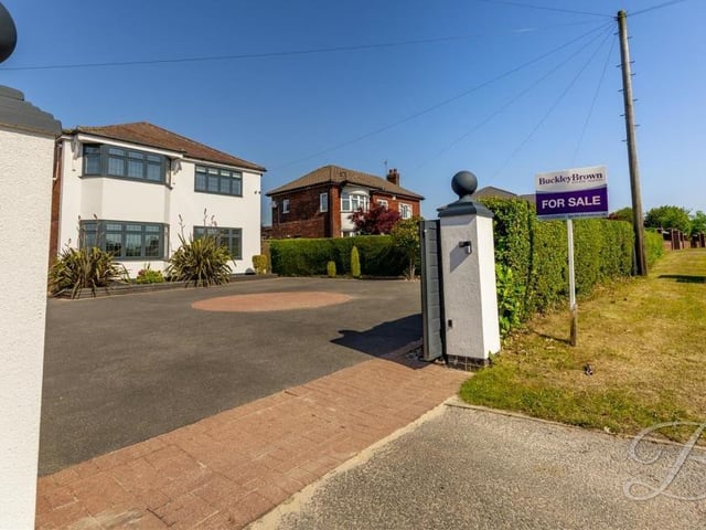 Once the gates are open, you'll find lots of space for off-street parking on the carriage driveway. Also at the front is an attached garage.