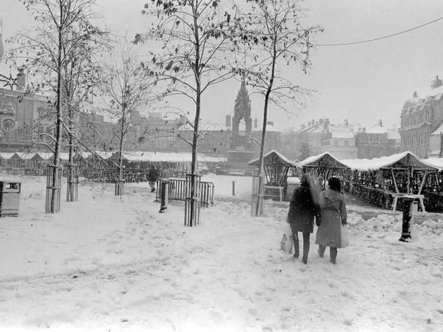 An empty Mansfield market covered in a blanket of snow.