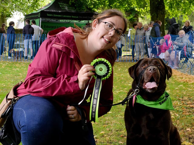 Teversal Village Summer Fete,  three year old Chocolate Lab Minstrel wins 1st prize in the dog show in 2019, pictured with owner Zoe Kelly