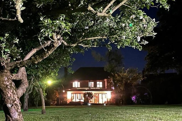 The final photo in our gallery is this arty night-time shot from the back garden that proves the Sutton property is, indeed, a true shining light,