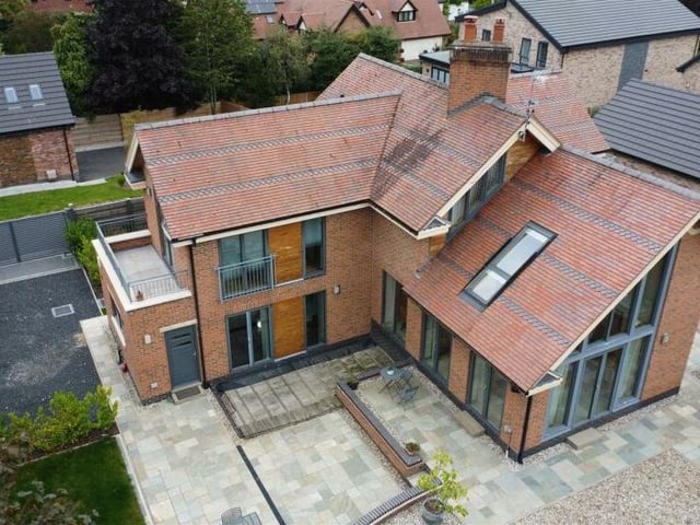 We close our gallery with another appealing shot from the skies, this time showing the back of the house.