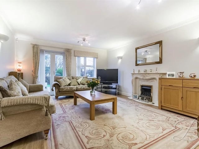 The perfect place for cosy family evenings. With laminate flooring, feature fireplace and double doors providing access directly onto the garden.