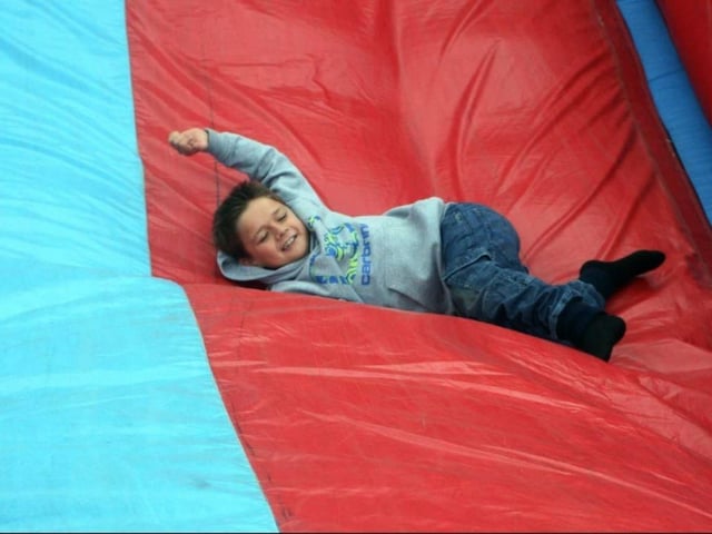 Kaylem Machin tries out the giant slide at the 2017 Blidworth Summer Fair.