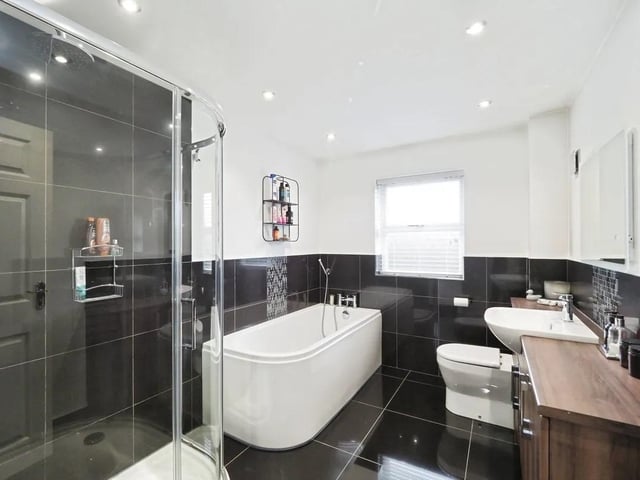 Relax and unwind in the luxury family bathroom.