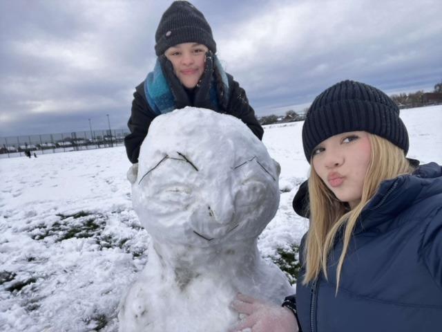 Tilly Smith and Zuzanna Maliszewska with their snowman