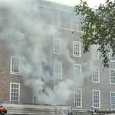Smoke billows from County Hall during the fire in July.