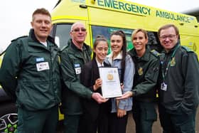 EMAS technician Michael Riviere,  driver technician Neil Butler, Lily and mum Nicola Channer, paramedic Laura Hurst and call taker Chris Turk, who nominated Lily.