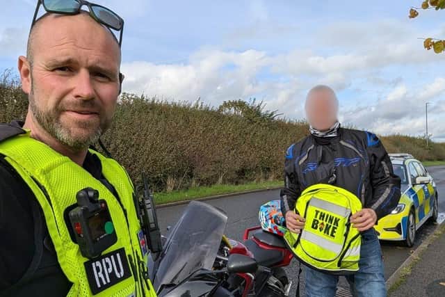PC Tom Rowlands with a biker