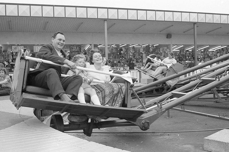 A family from Clipstone enjoys a funfair ride in 1973.