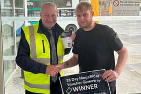 Ethan Evans receives his 28-day Megarider ticket from operations manager Peter Russell. Photo: Submitted