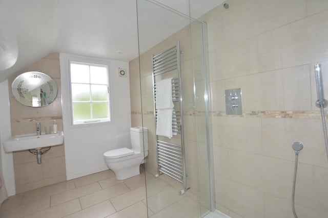 As well as the three bedrooms, the first floor also houses this shower room. A walk-in Bristan shower is complemented by a low-level WC, wash hand basin and heated towel-rail