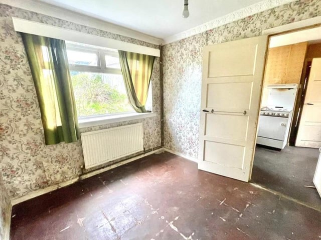 Given that it sits just off the kitchen, this second reception room could be the family dining area. As you can see, it lets in lots of natural light.