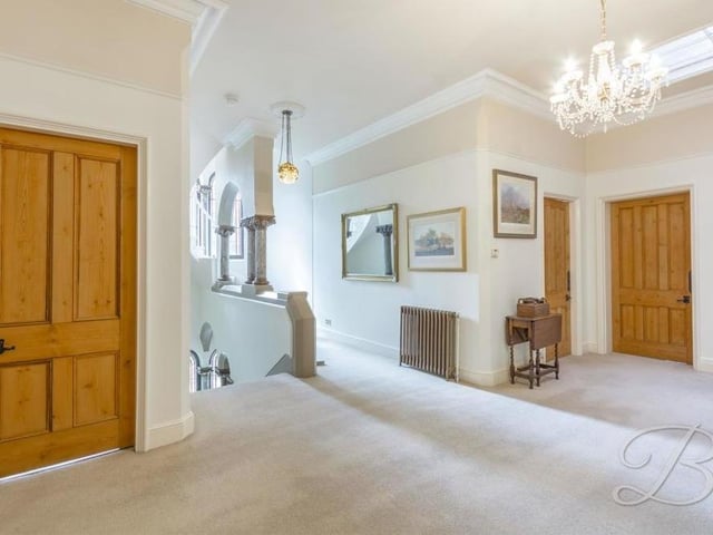 Arriving on the first floor, you are greeted by this lovely, spacious landing, which includes period marble columns and two stained glass windows to the front of the mansion. There is also an airing cupboard and access to the tower.