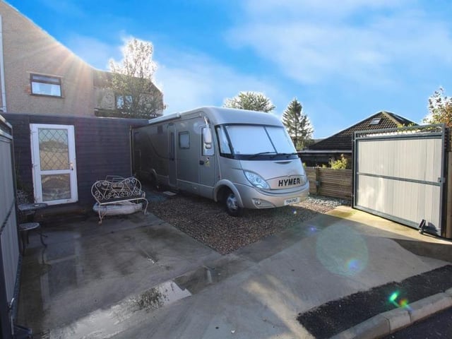 For a two-bed bungalow, the property offers a generous amount of off-street parking space. Behind the security gates at the entrance, there is even room for a caravan or motorhome.