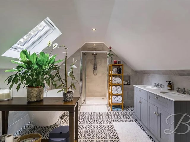 Complete with a four piece suite matching that of the ensuite including a freestanding bath, spacious walk-in shower cubicle, low flush WC and hand wash vanity unit.