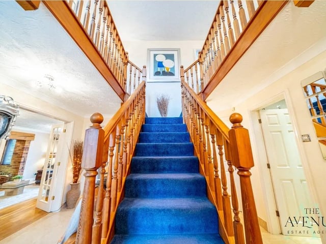 A warm welcome awaits with this show stopping entrance with stunning staircase.
