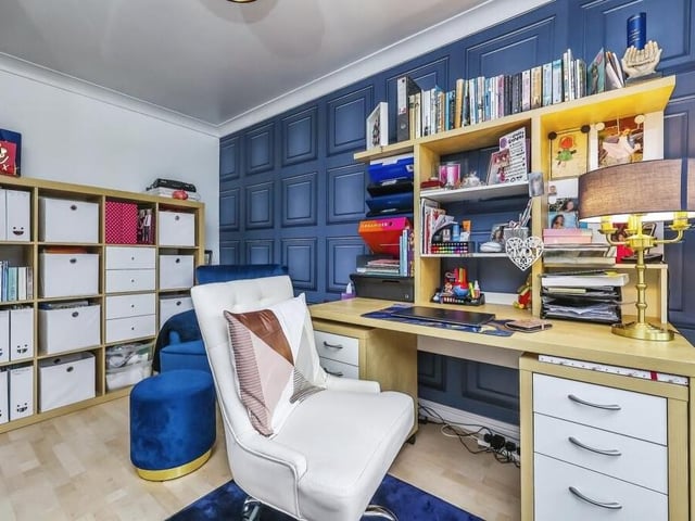 This colourful study or office is ideal for those who prefer to work from home. It boasts a laminated floor and a uPVC double-glazed bay window facing the front of the Portland Road house.