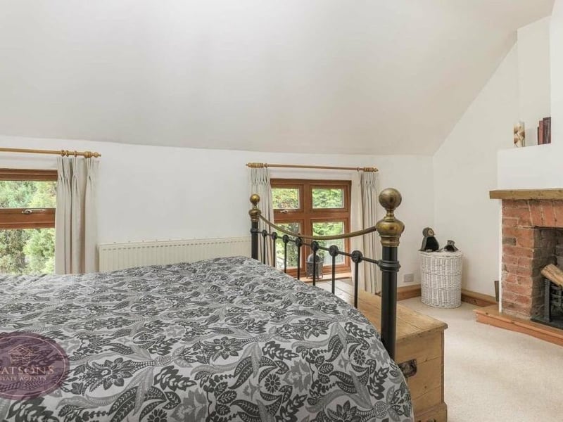 By now, you will be well used to seeing original features in the rooms at the old Bagthorpe property, which dates back to the 1700s. This bedroom includes an exposed brick fireplace.