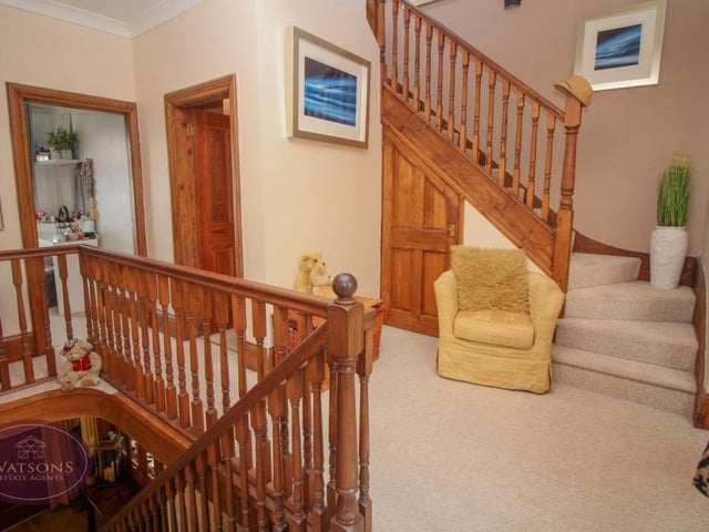 At the top of the stairs is this first-floor landing that guides you to three of the property's bedrooms, plus the family bathroom. As you can see, a further staircase leads to the second floor, where you can find the primary bedroom.