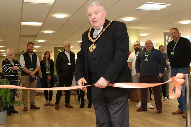 Nottinghamshire County Council chairman Coun Mike Quigley MBE, cuts the ribbon