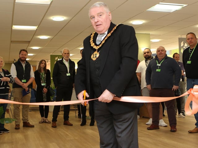 Nottinghamshire County Council chairman Coun Mike Quigley MBE, cuts the ribbon