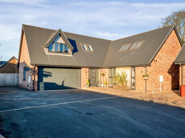 The private driveway also leads to a sizeable, integral double garage.