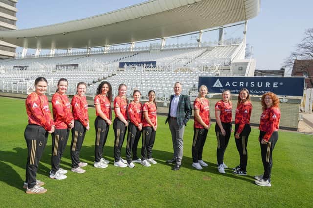 Mark McIlquham, CEO of Acrisure UK with members of The Blaze  in the new Acrisure sponsored kit.