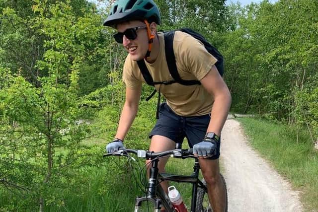 Student paramedic Dan Roizer, of Sutton, on the bike that was stolen from King's Mill Hospital.