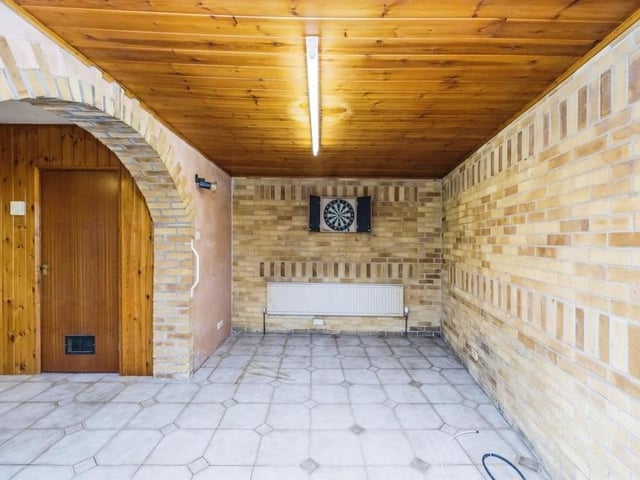 The dining area and extra living space, through the archways, is versatile and flexible. Maybe it could be turned into a games room.