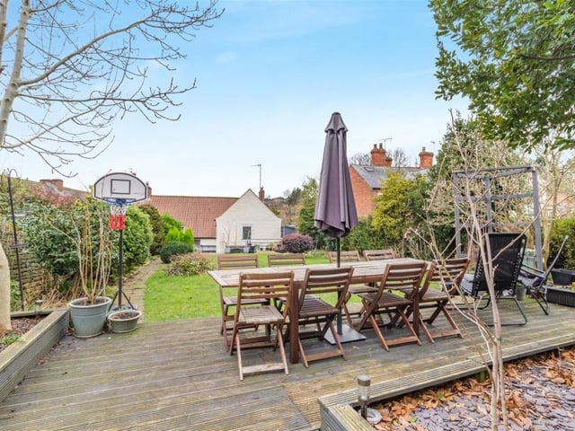 Here is a close-up of the decked patio at the far end of the back garden. When the sun shines, it is the ideal spot to entertain family and friends.